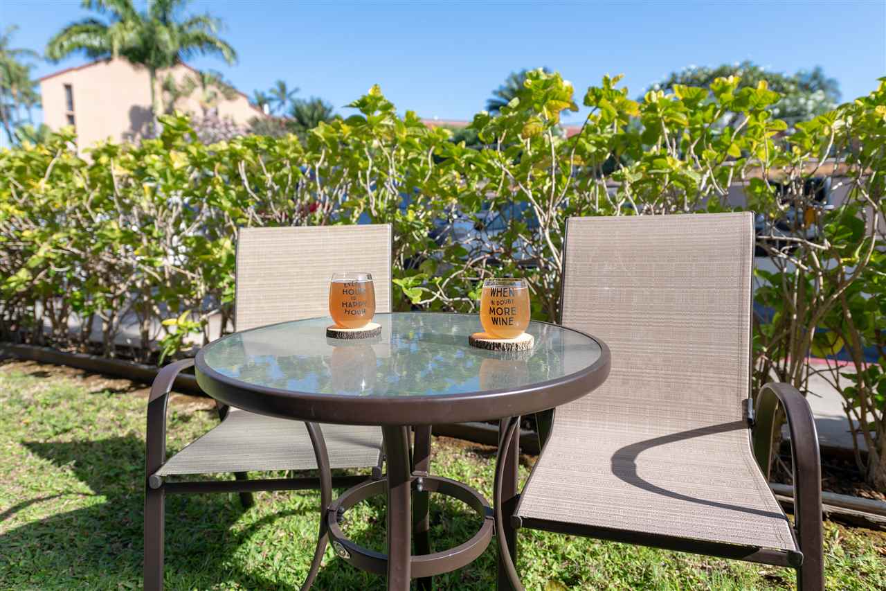2219 South Kihei Road, Unit B104 Kihei, HI 96753 - Photo 12 of 27 a view of a chairs and table in the patio