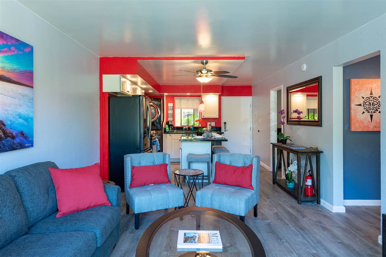 2219 South Kihei Road, Unit B104 Kihei, HI 96753 - Photo 13 of 27 a living room with furniture kitchen view and a flat screen tv