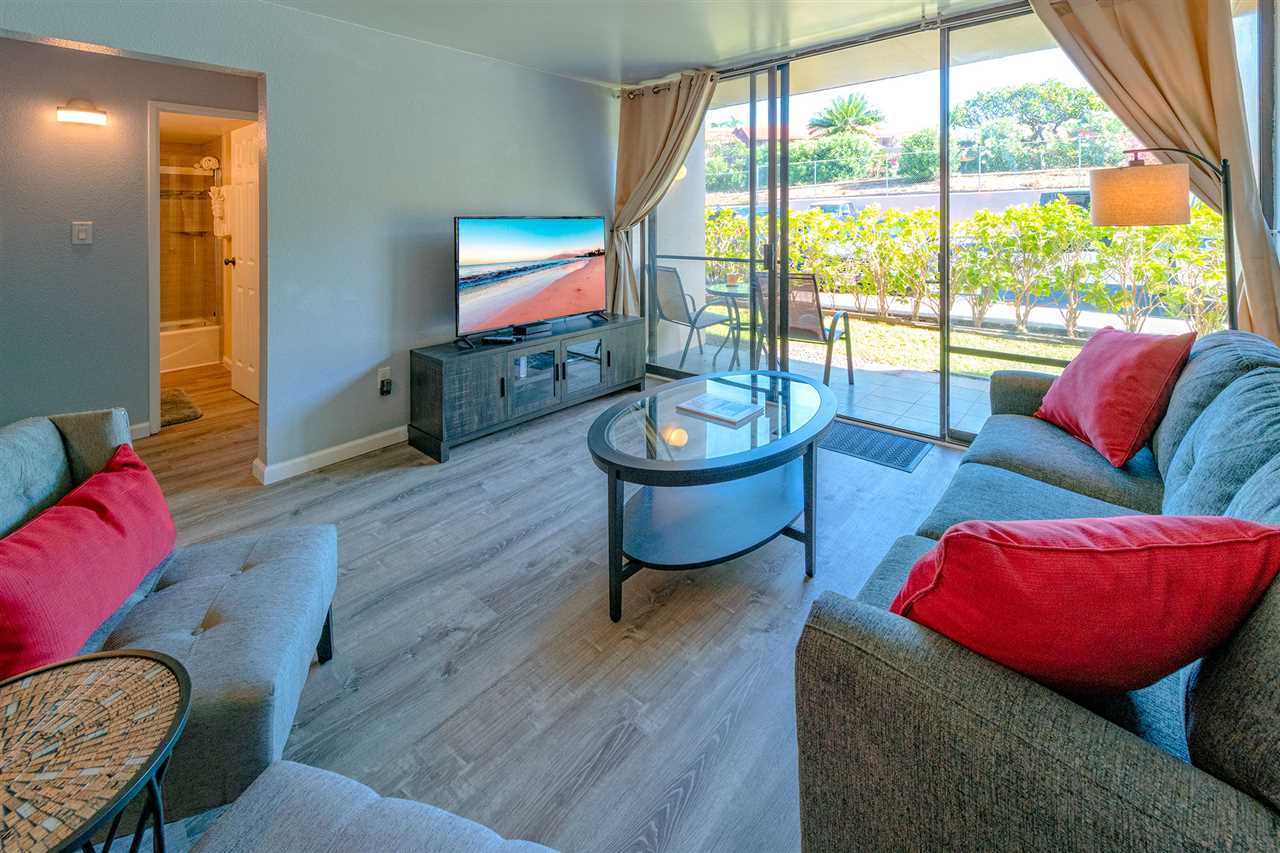 2219 South Kihei Road, Unit B104 Kihei, HI 96753 - Photo 16 of 27 a living room with furniture and a flat screen tv