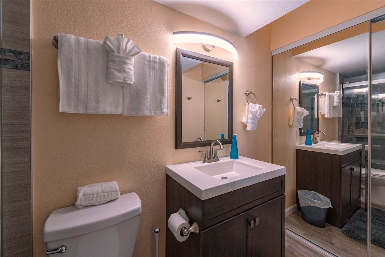 2219 South Kihei Road, Unit B104 Kihei, HI 96753 - Photo 20 of 27 a bathroom with a sink a toilet and mirror