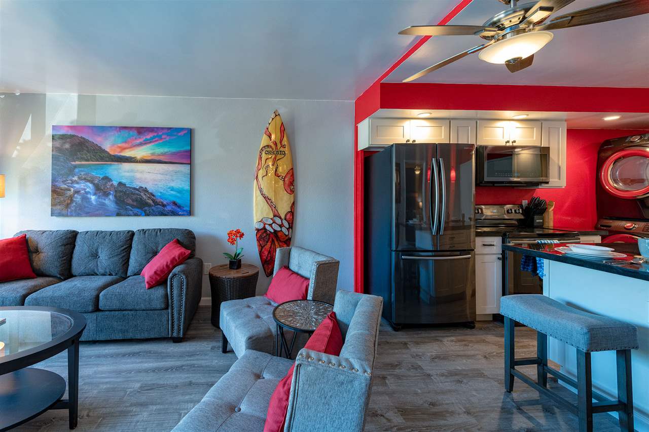 2219 South Kihei Road, Unit B104 Kihei, HI 96753 - Photo 21 of 27 a living room with furniture gym equipment and kitchen appliances