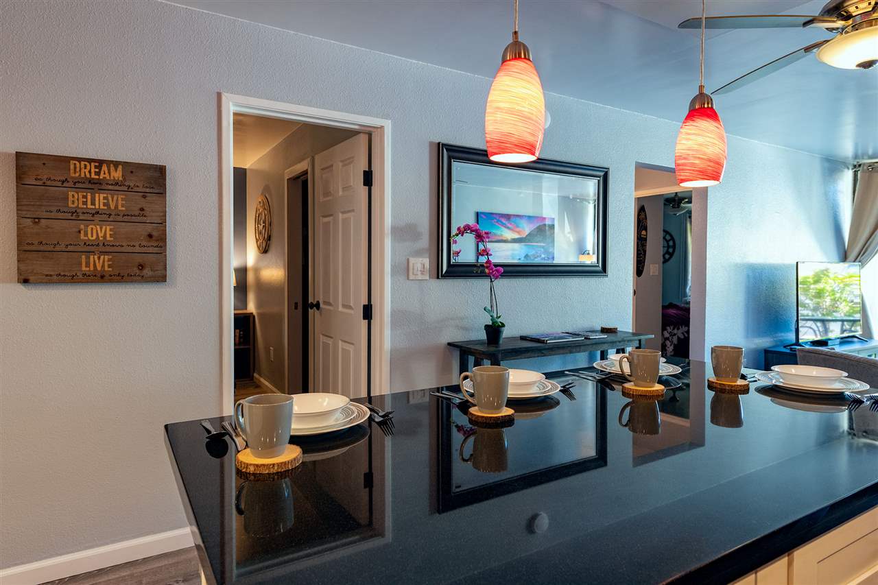 2219 South Kihei Road, Unit B104 Kihei, HI 96753 - Photo 22 of 27 a living room with furniture and a flat screen tv