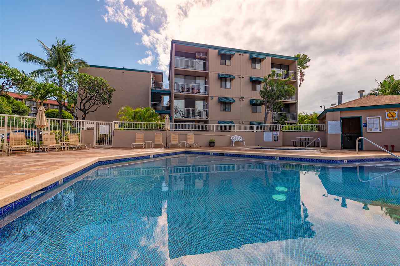 2219 South Kihei Road, Unit B104 Kihei, HI 96753 - Photo 25 of 27 a swimming pool is sitting in front of a house