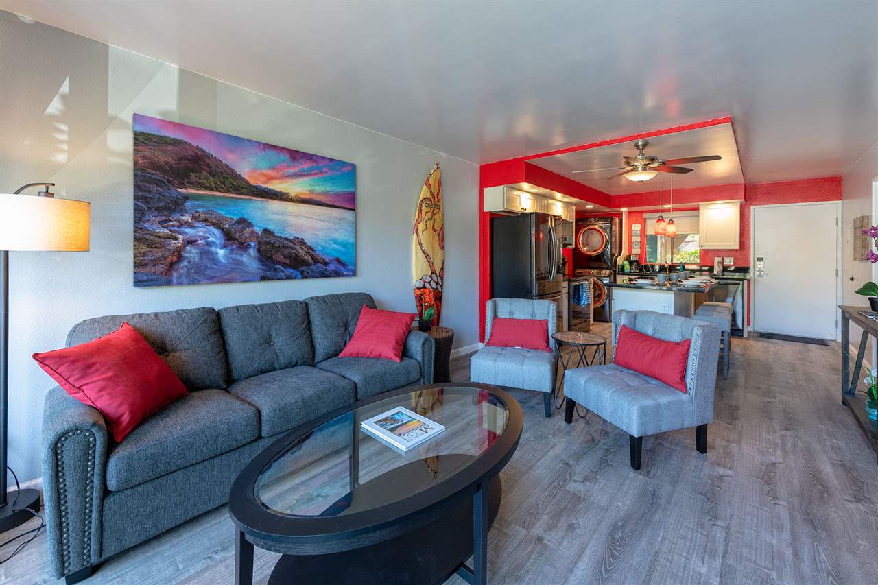 2219 South Kihei Road, Unit B104 Kihei, HI 96753 - Photo 5 of 27 a living room with furniture and wooden floor