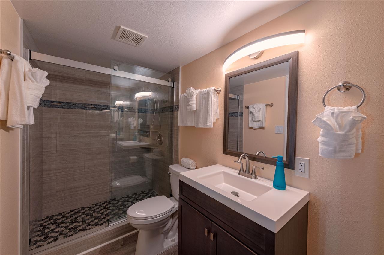 2219 South Kihei Road, Unit B104 Kihei, HI 96753 - Photo 9 of 27 a bathroom with a sink toilet and shower