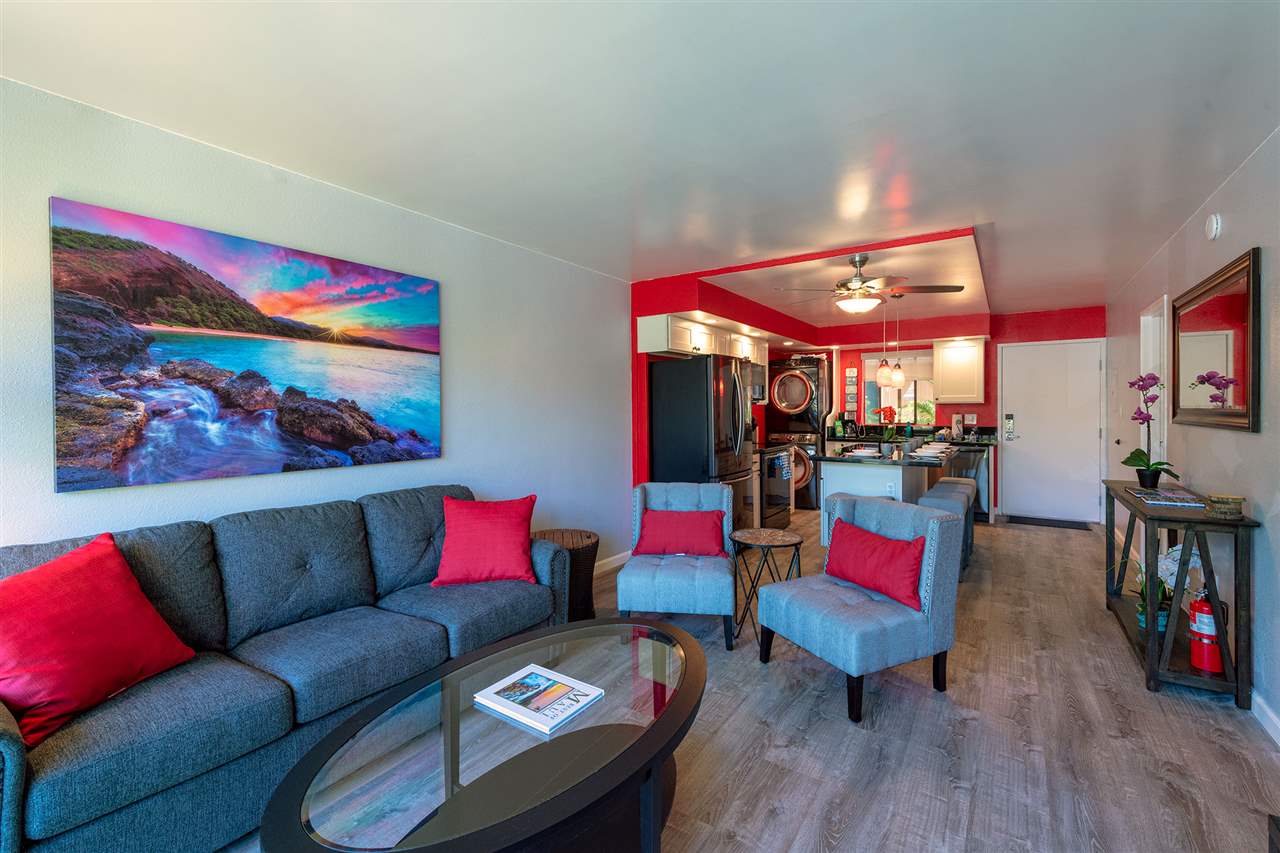 2219 South Kihei Road, Unit B104 Kihei, HI 96753 - Photo 10 of 27 a living room with furniture kitchen view and a wooden floor
