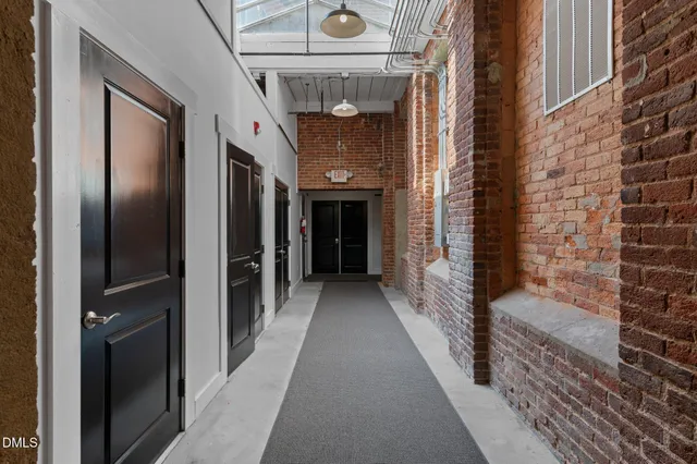 a view of a street with a building in the background