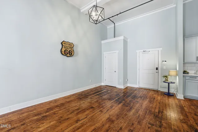 a kitchen with a refrigerator a sink and a microwave