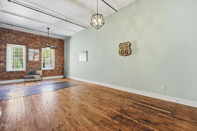 an aerial view of a house with a yard basket ball court and outdoor seating