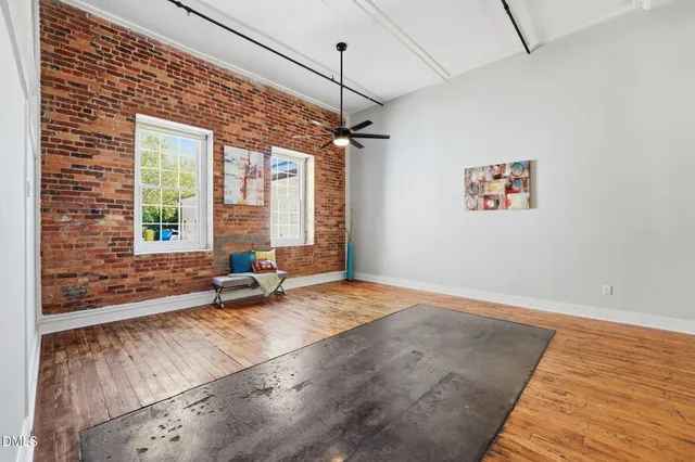 a living room with couch next to a window