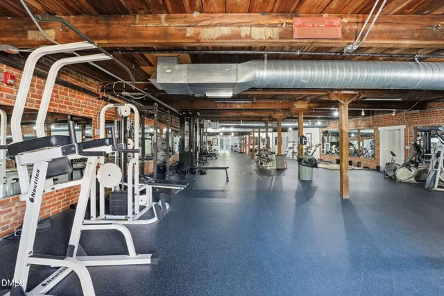 a view of a studio with wooden floor
