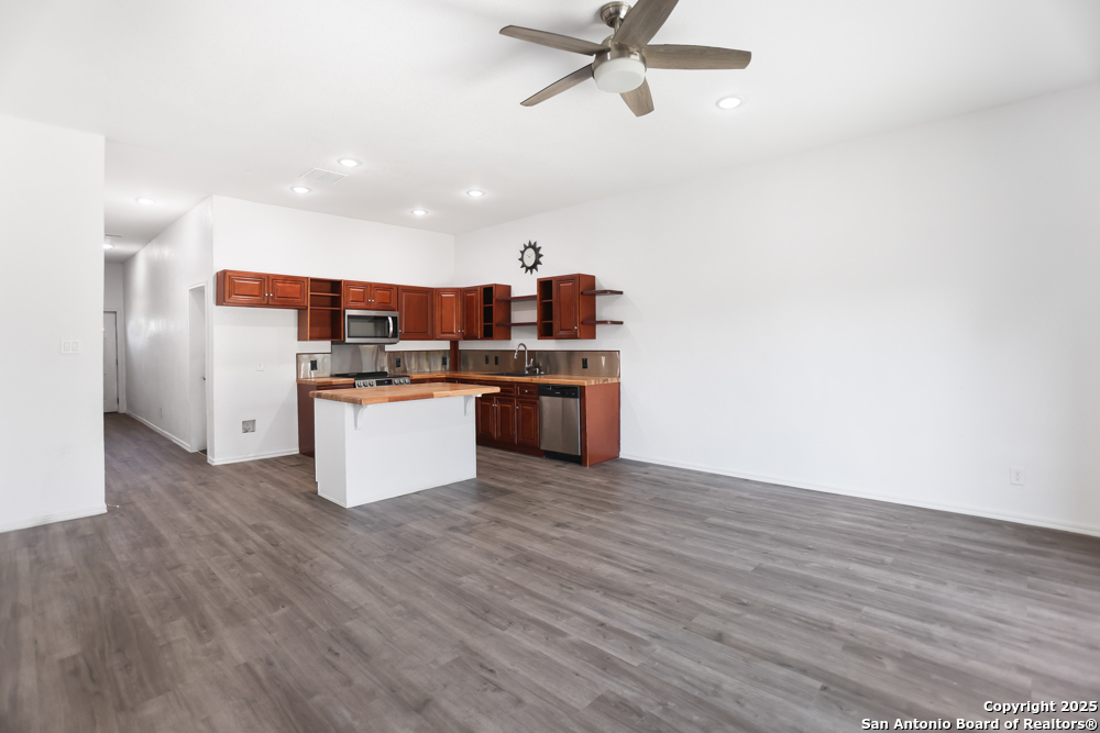 8611 Key Windy Way, Unit 2 Converse, TX 78109 - Photo 12 of 26 a view of a kitchen with wooden floor