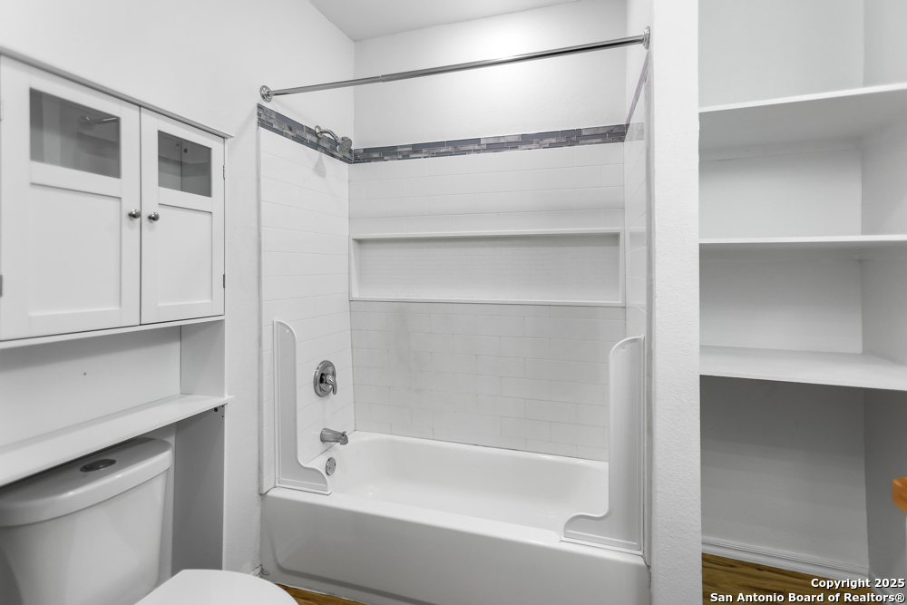 8611 Key Windy Way, Unit 2 Converse, TX 78109 - Photo 18 of 26 a bathroom with a bathtub a toilet and a shower