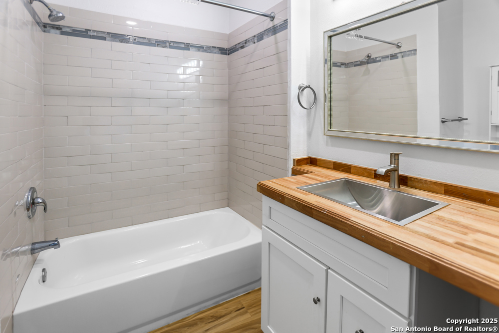 8611 Key Windy Way, Unit 2 Converse, TX 78109 - Photo 22 of 26 a bathroom with a sink and a shower