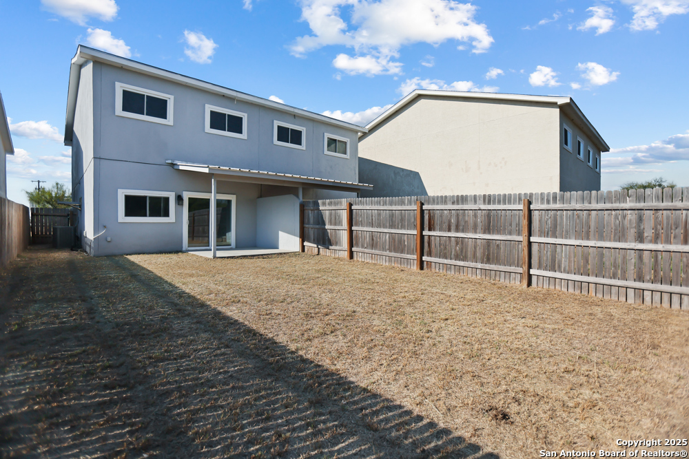 8611 Key Windy Way, Unit 2 Converse, TX 78109 - Photo 25 of 26 a view of a house with a wooden fence