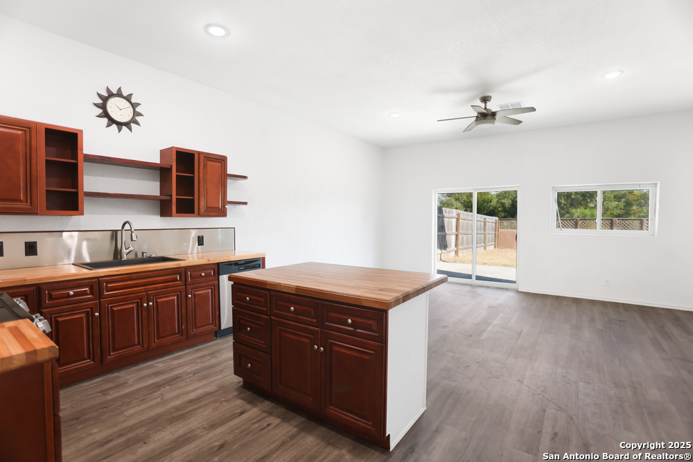 8611 Key Windy Way, Unit 2 Converse, TX 78109 - Photo 6 of 26 a kitchen with stainless steel appliances granite countertop a stove a sink and a refrigerator