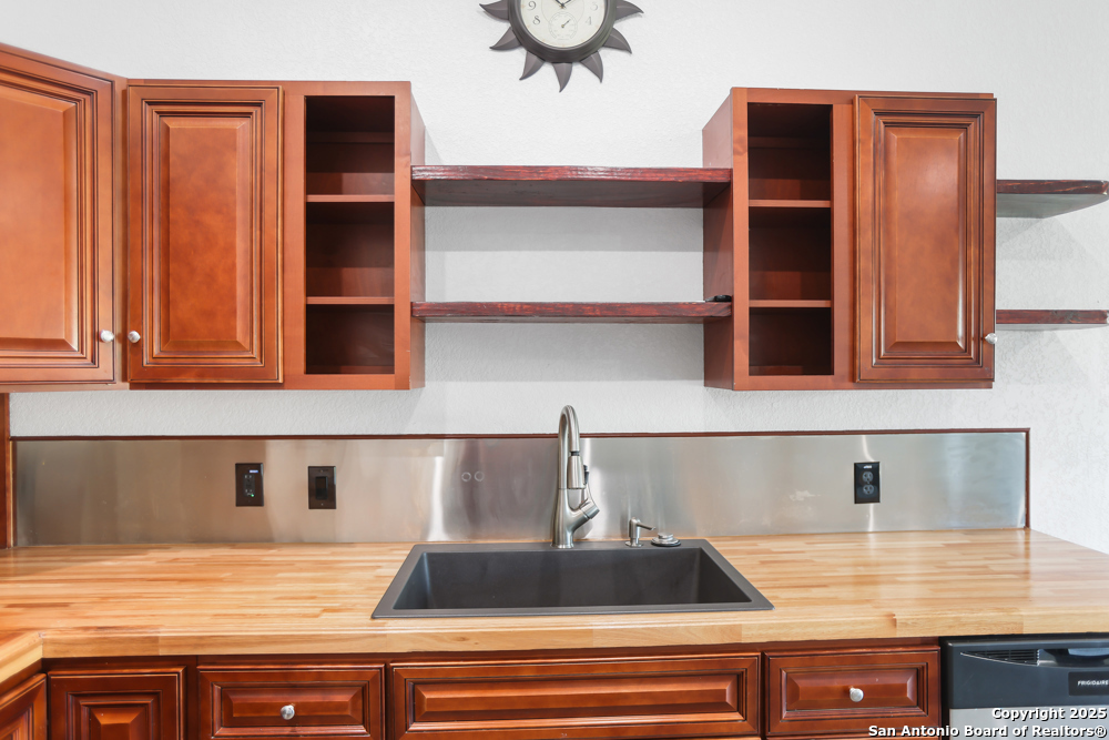 8611 Key Windy Way, Unit 2 Converse, TX 78109 - Photo 7 of 26 a kitchen with a sink and cabinets