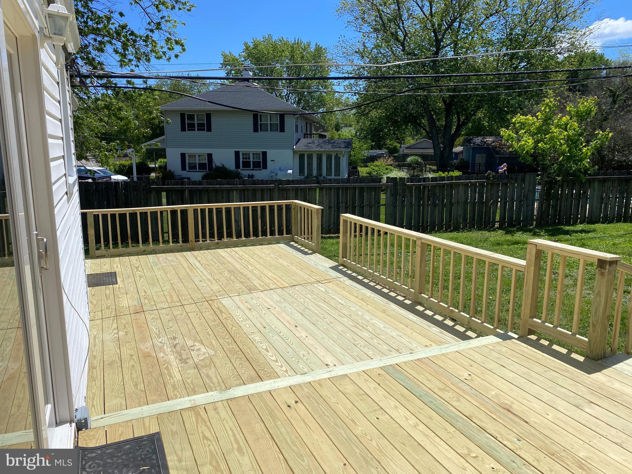 301 Beverley Place Edgewater, MD 21037 - Photo 2 of 44 a view of balcony with wooden floor and fence