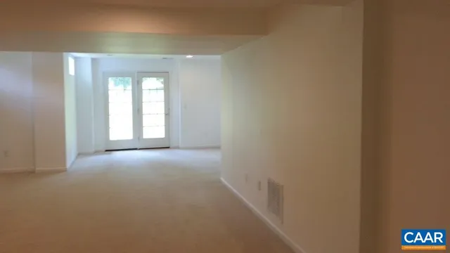 a view of empty room with windows