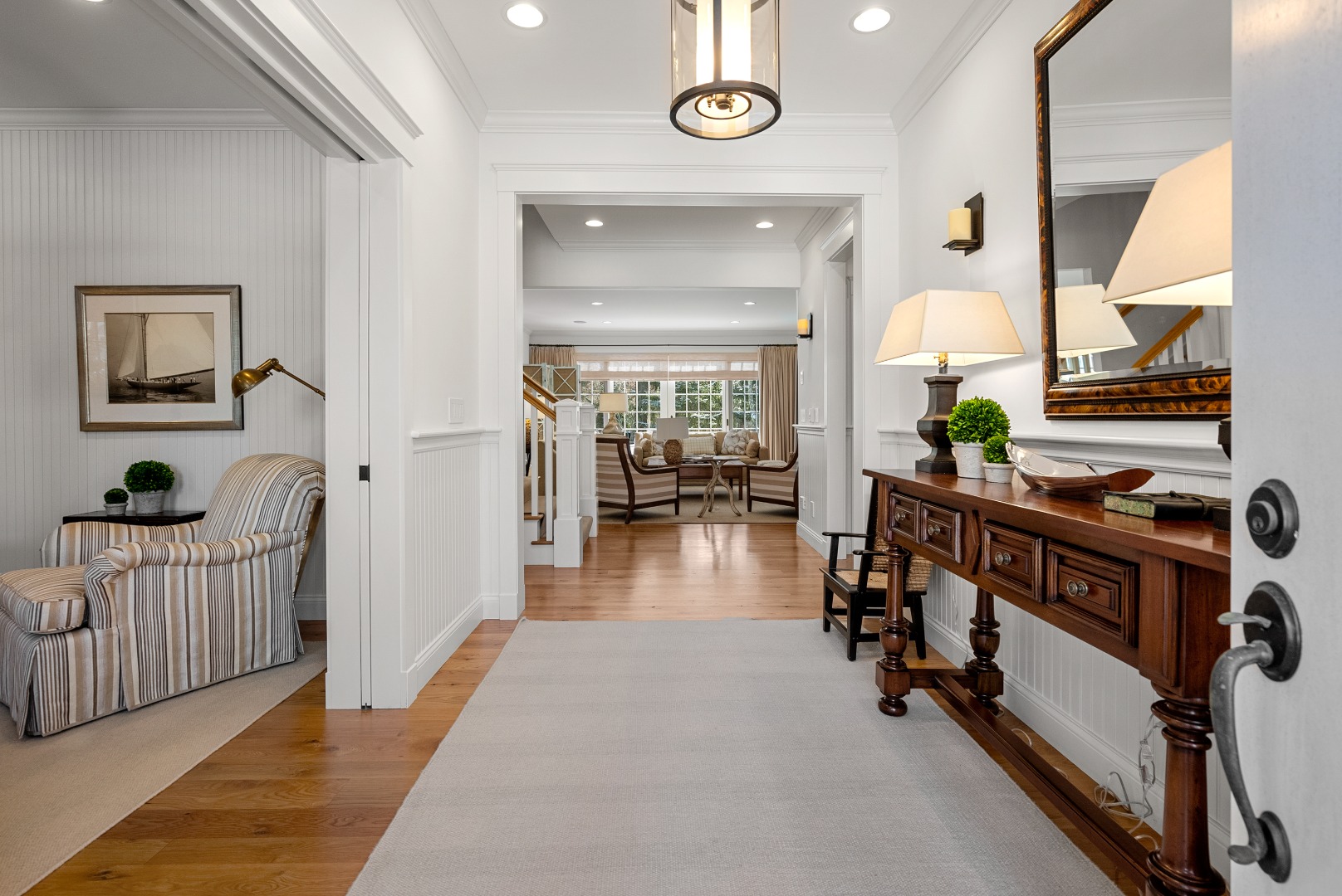 243 Katama Road Edgartown, MA 02539 - Photo 20 of 42 a view of a hallway to a livingroom with furniture and hardwood floor