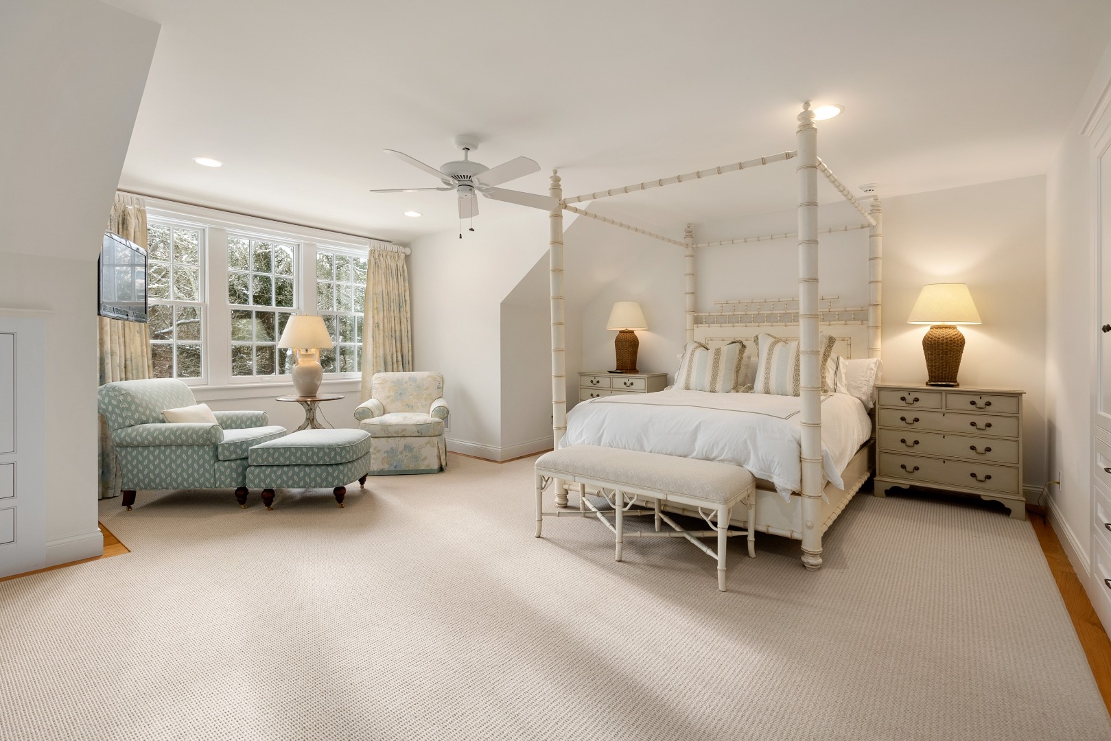 243 Katama Road Edgartown, MA 02539 - Photo 26 of 42 a bedroom with furniture and a chandelier