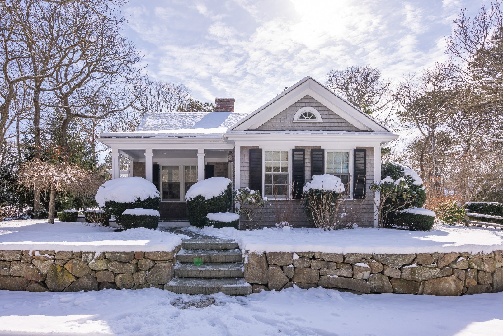 243 Katama Road Edgartown, MA 02539 - Photo 33 of 42 a front view of a house with yard outdoor seating and barbeque oven
