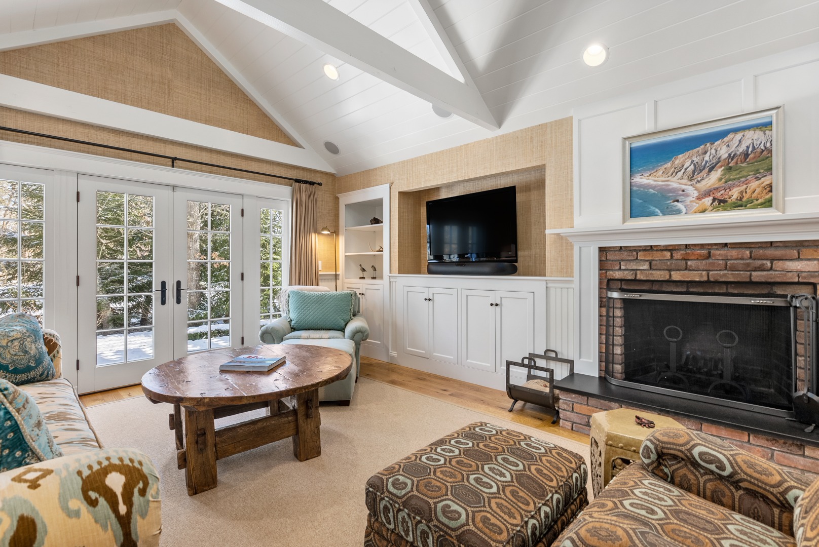 243 Katama Road Edgartown, MA 02539 - Photo 35 of 42 a living room with furniture a flat screen tv and a fireplace