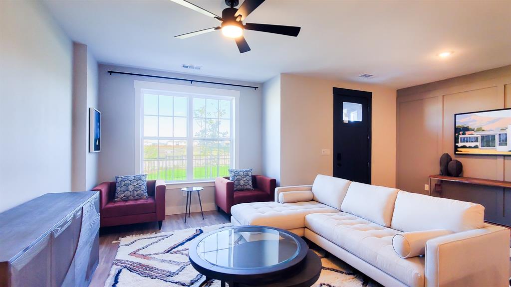 1629 Palladio Loop Princeton, TX 75407 - Photo 6 of 8 a living room with furniture and a large window