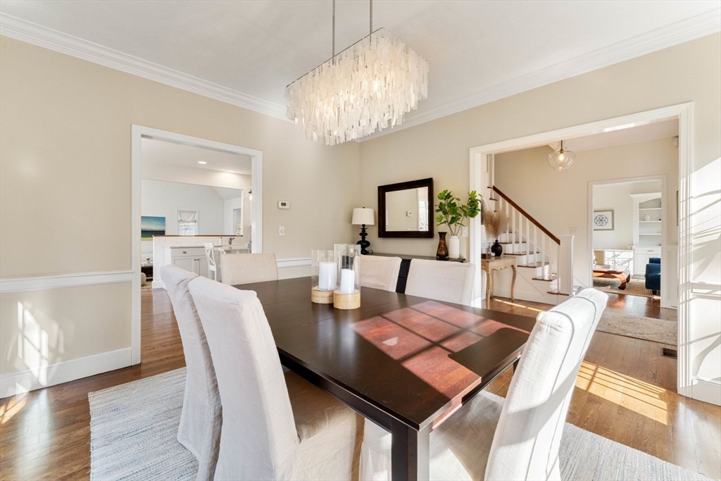 10 Franklin Rodgers Road Hingham, MA 02043 - Photo 12 of 31 a view of a dining room with furniture a chandelier and wooden floor