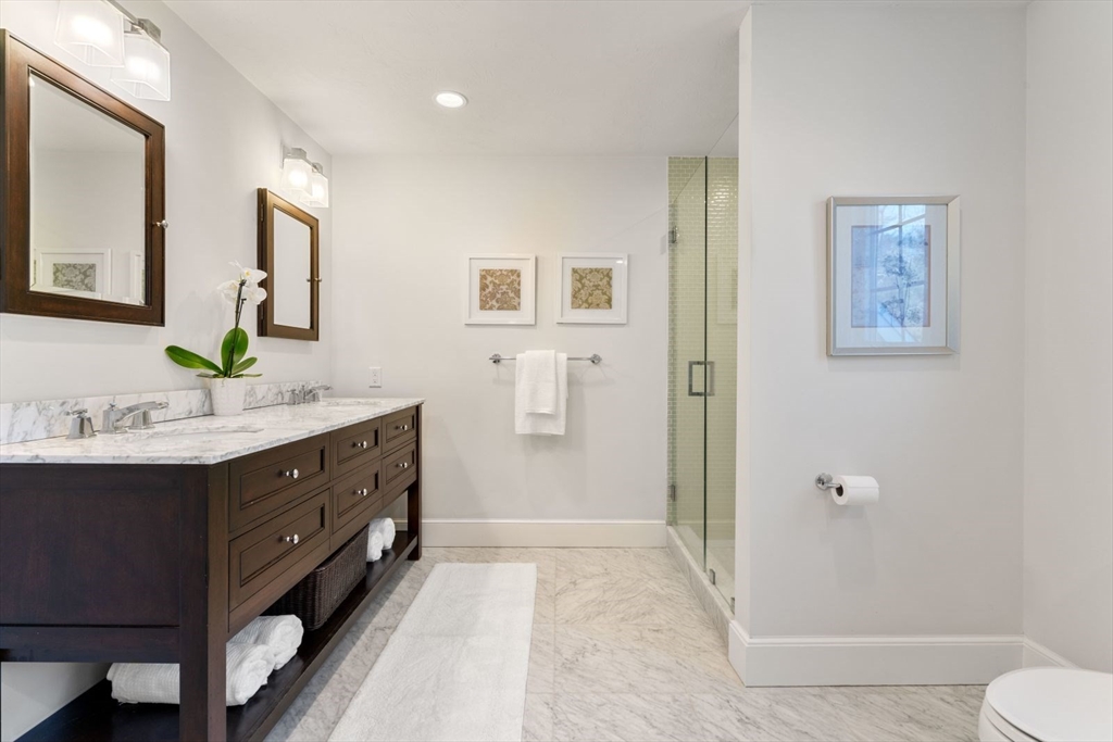 10 Franklin Rodgers Road Hingham, MA 02043 - Photo 19 of 31 a bathroom with a double vanity sink toilet and shower