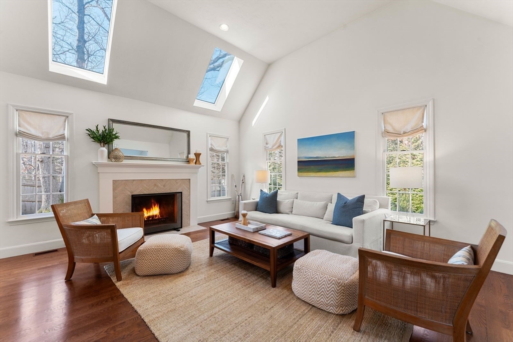 10 Franklin Rodgers Road Hingham, MA 02043 - Photo 2 of 31 a living room with furniture and a fireplace
