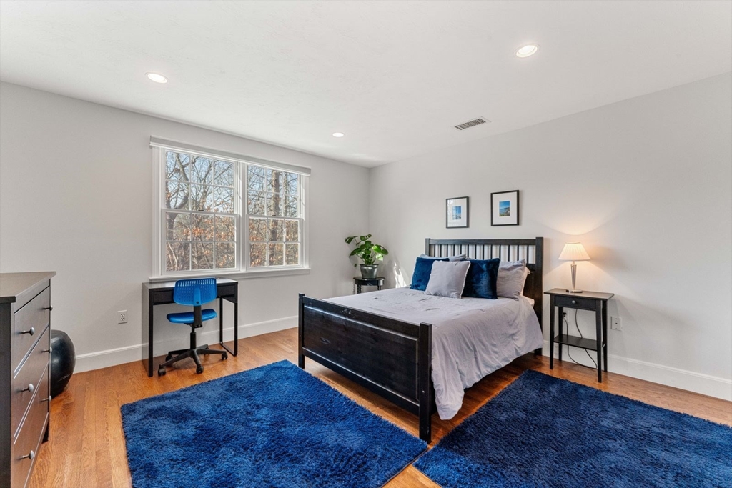 10 Franklin Rodgers Road Hingham, MA 02043 - Photo 23 of 31 a bedroom with a bed and a table in it