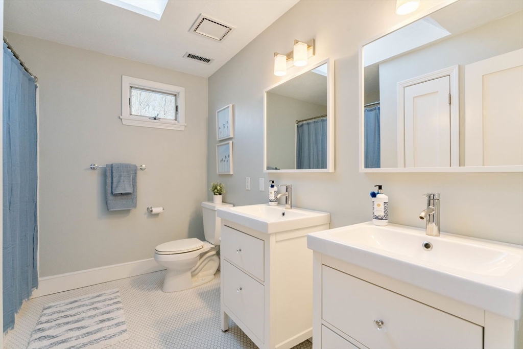 10 Franklin Rodgers Road Hingham, MA 02043 - Photo 24 of 31 a bathroom with a toilet sink and mirror
