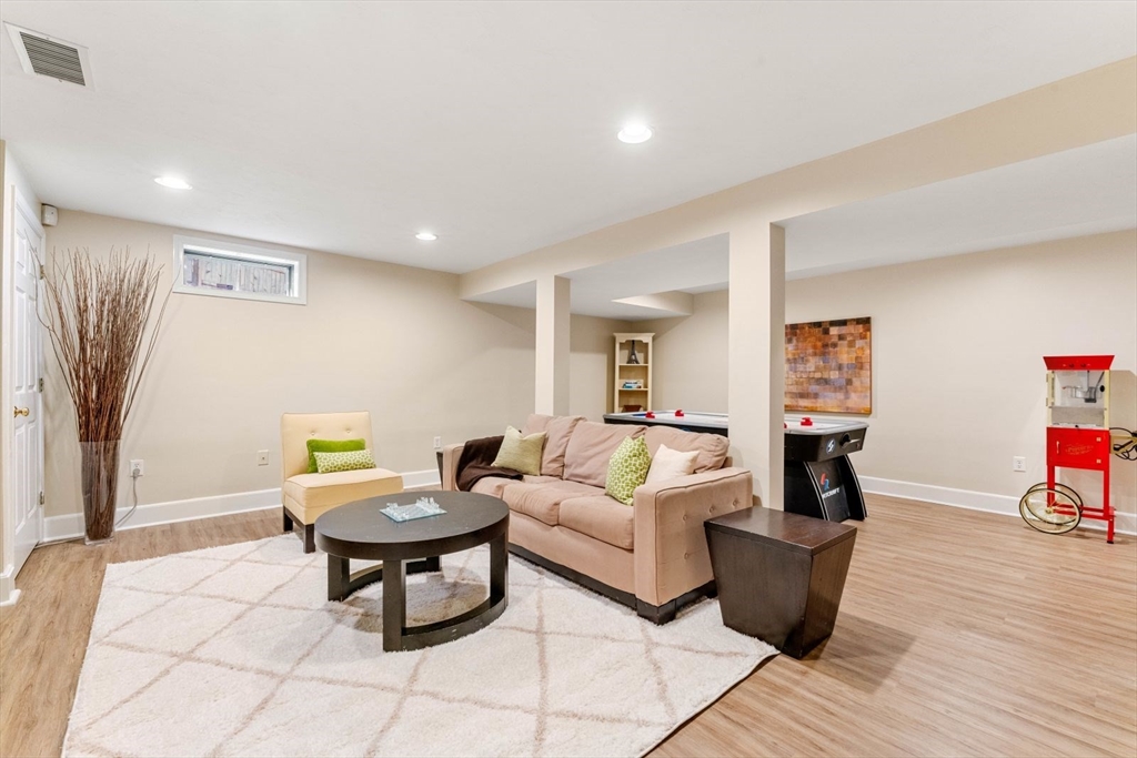 10 Franklin Rodgers Road Hingham, MA 02043 - Photo 26 of 31 a living room with furniture and a wooden floor
