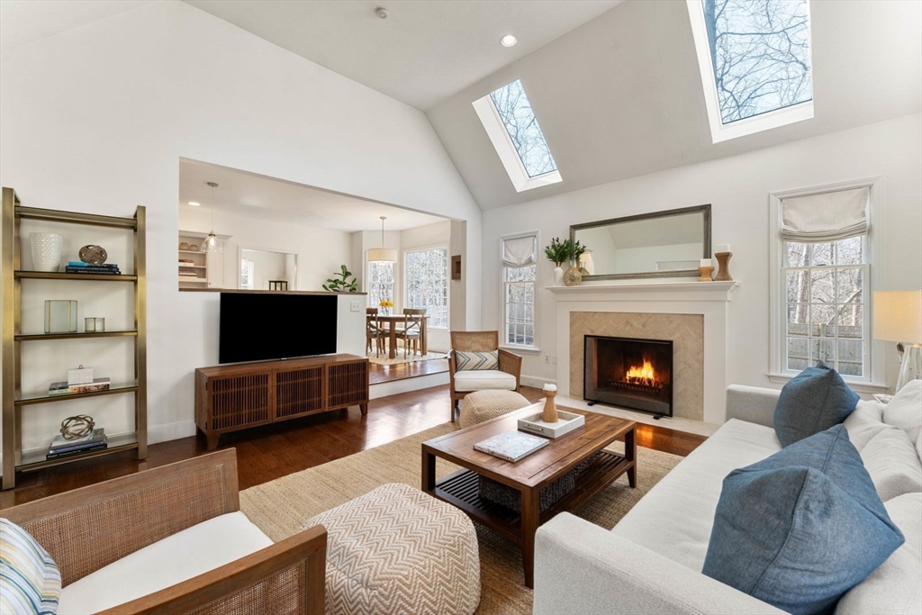 10 Franklin Rodgers Road Hingham, MA 02043 - Photo 3 of 31 a living room with furniture a flat screen tv and a fireplace