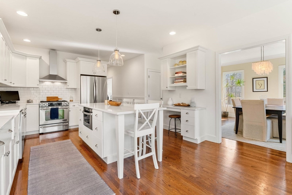 10 Franklin Rodgers Road Hingham, MA 02043 - Photo 9 of 31 a kitchen with white cabinets and stainless steel appliances