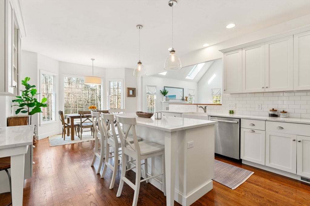 10 Franklin Rodgers Road Hingham, MA 02043 - Photo 10 of 31 a kitchen with a table chairs sink and cabinets