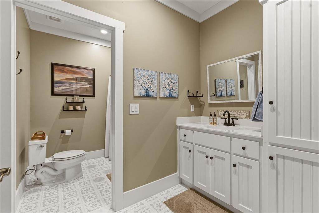 2162 Valley View Drive Jasper, GA 30143 - Photo 27 of 52 a spacious bathroom with a toilet sink and mirror