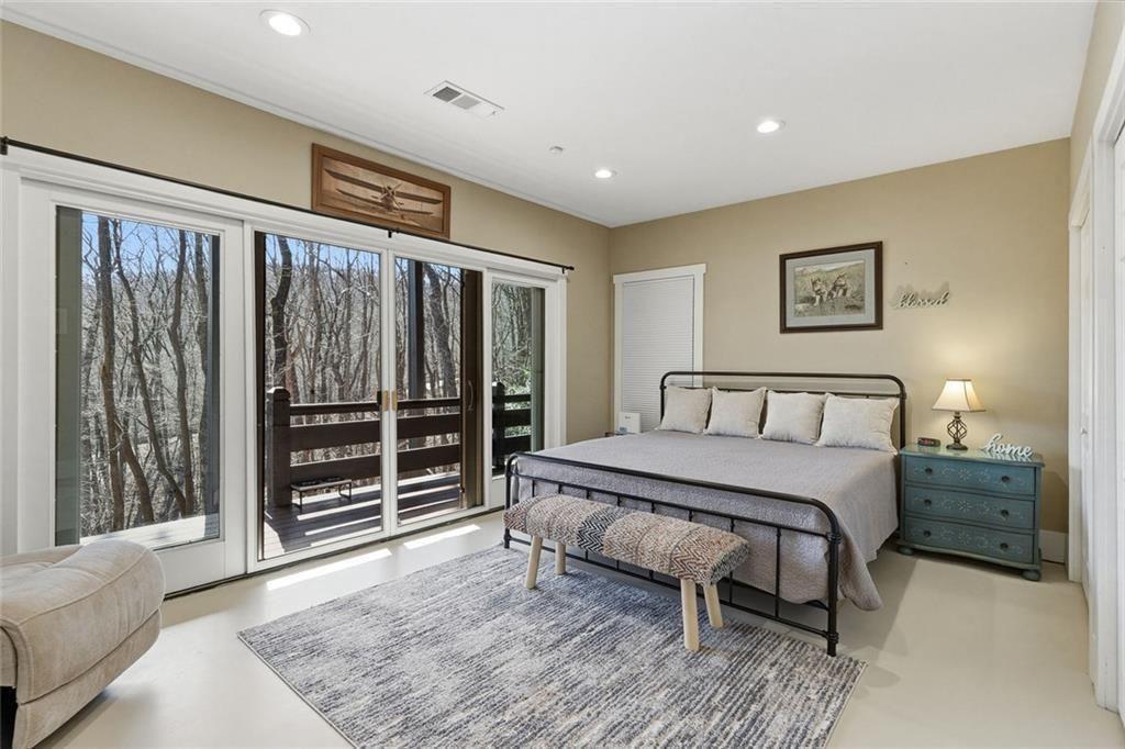 2162 Valley View Drive Jasper, GA 30143 - Photo 31 of 52 a spacious bedroom with a bed and a large window