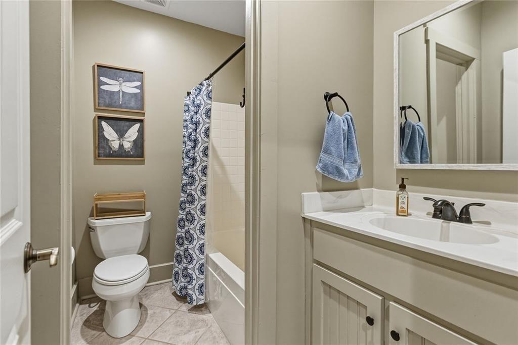 2162 Valley View Drive Jasper, GA 30143 - Photo 33 of 52 a bathroom with a toilet a sink and mirror