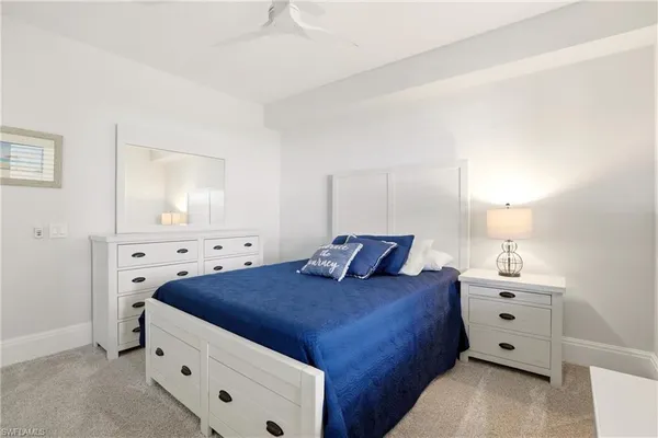 a large white bed in a white room