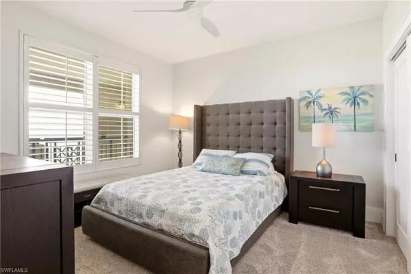a bedroom with a bed and a closet