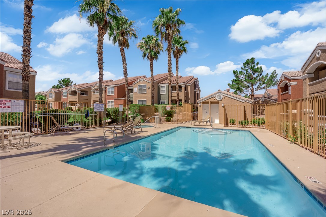 8101 West Flamingo Road, Unit 2030 Las Vegas, NV 89147 - Photo 7 of 27 Palm trees shade a refreshing community pool bordered by attractive residences.