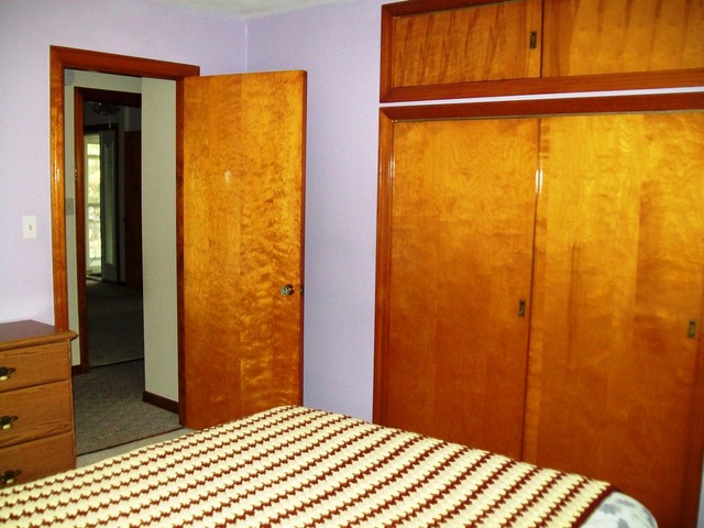 19419 Wolf Road Mokena, IL 60448 - Photo 7 of 19 a bedroom with a bed and a closet