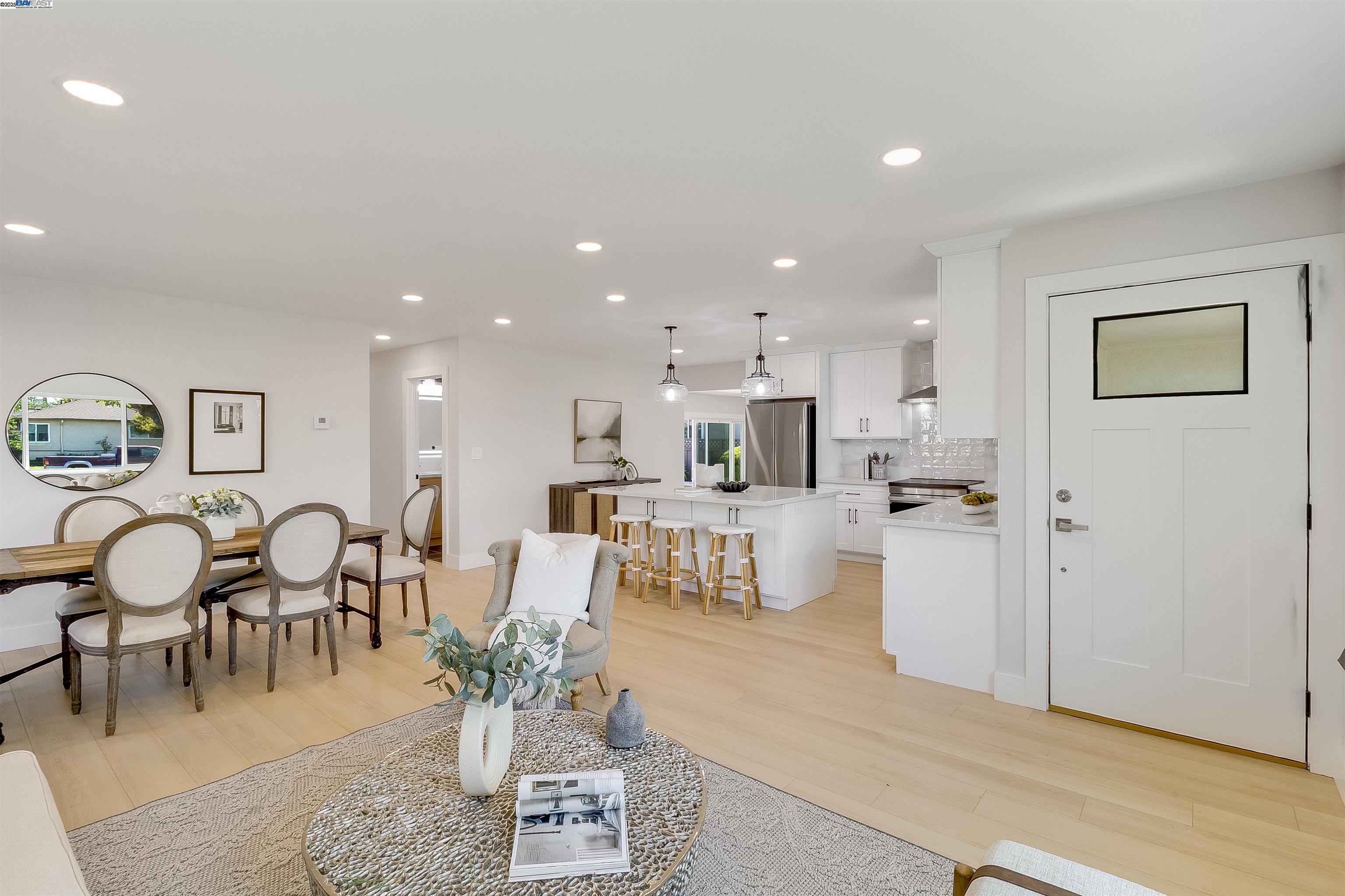 736 Adams Avenue Livermore, CA 94550 - Photo 13 of 52 a living room with furniture kitchen view and a dining table