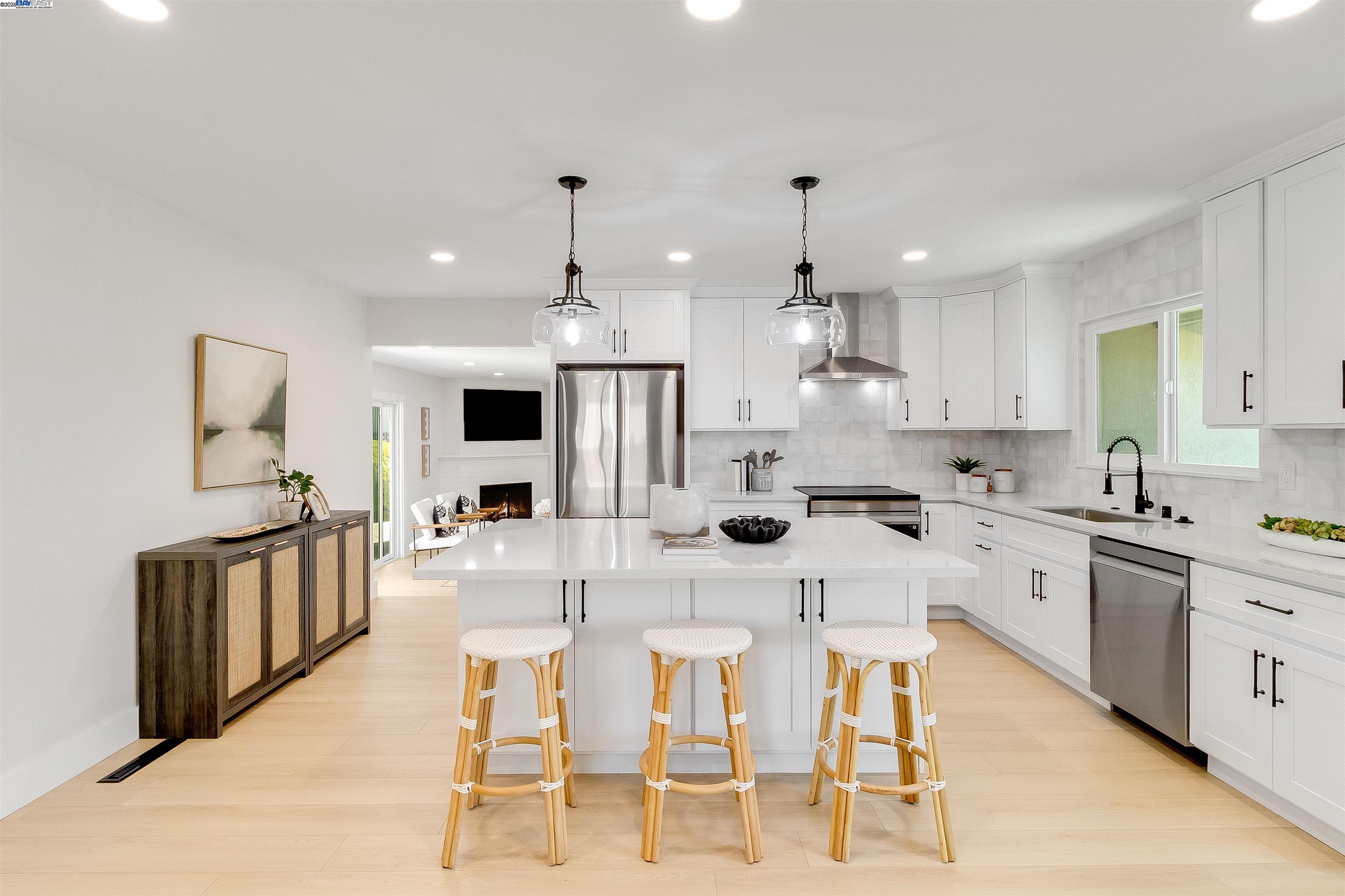 736 Adams Avenue Livermore, CA 94550 - Photo 14 of 52 a kitchen with stainless steel appliances kitchen island granite countertop a sink and cabinets
