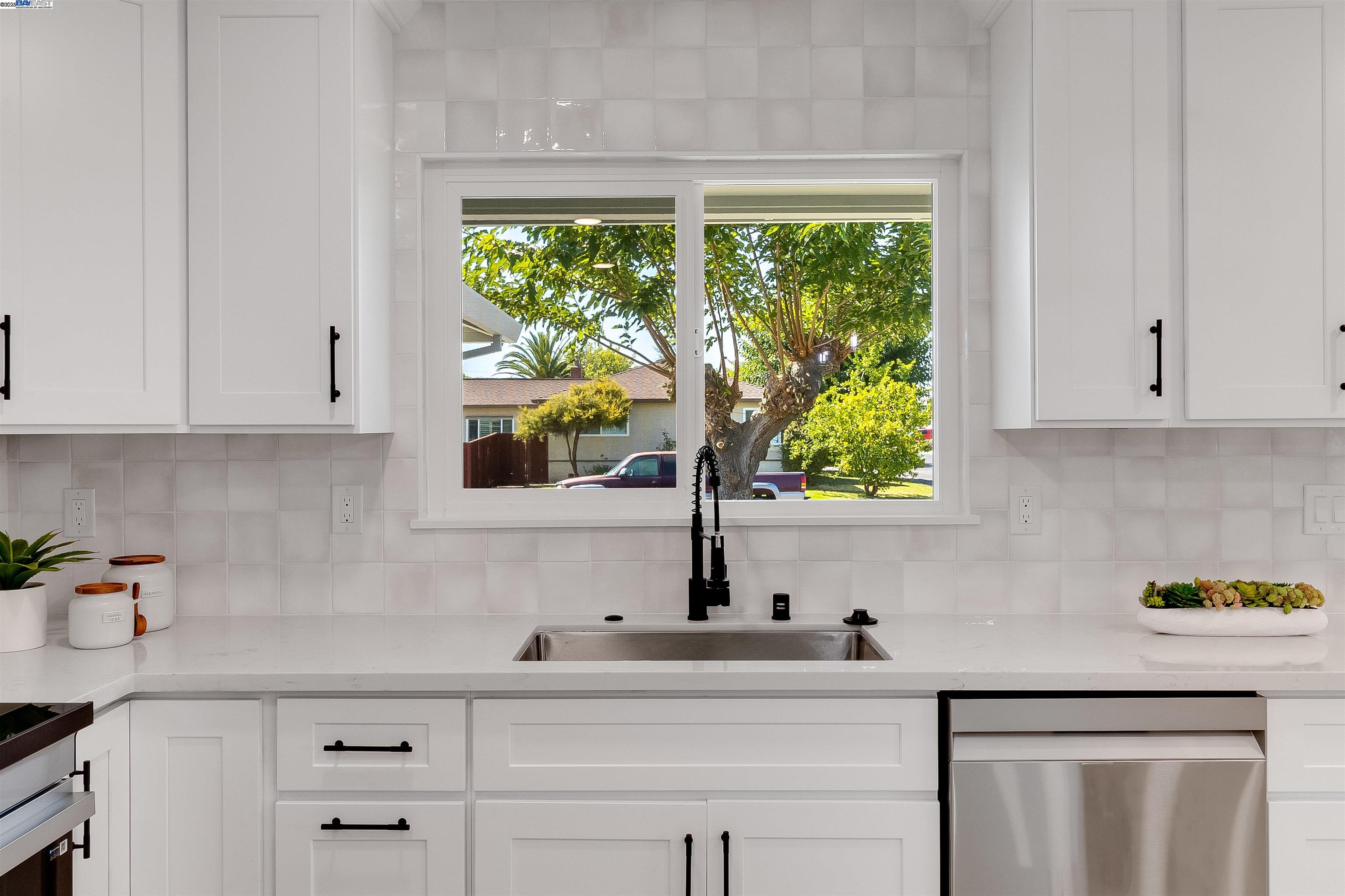 736 Adams Avenue Livermore, CA 94550 - Photo 20 of 52 a kitchen with stainless steel appliances white cabinets a window and a sink