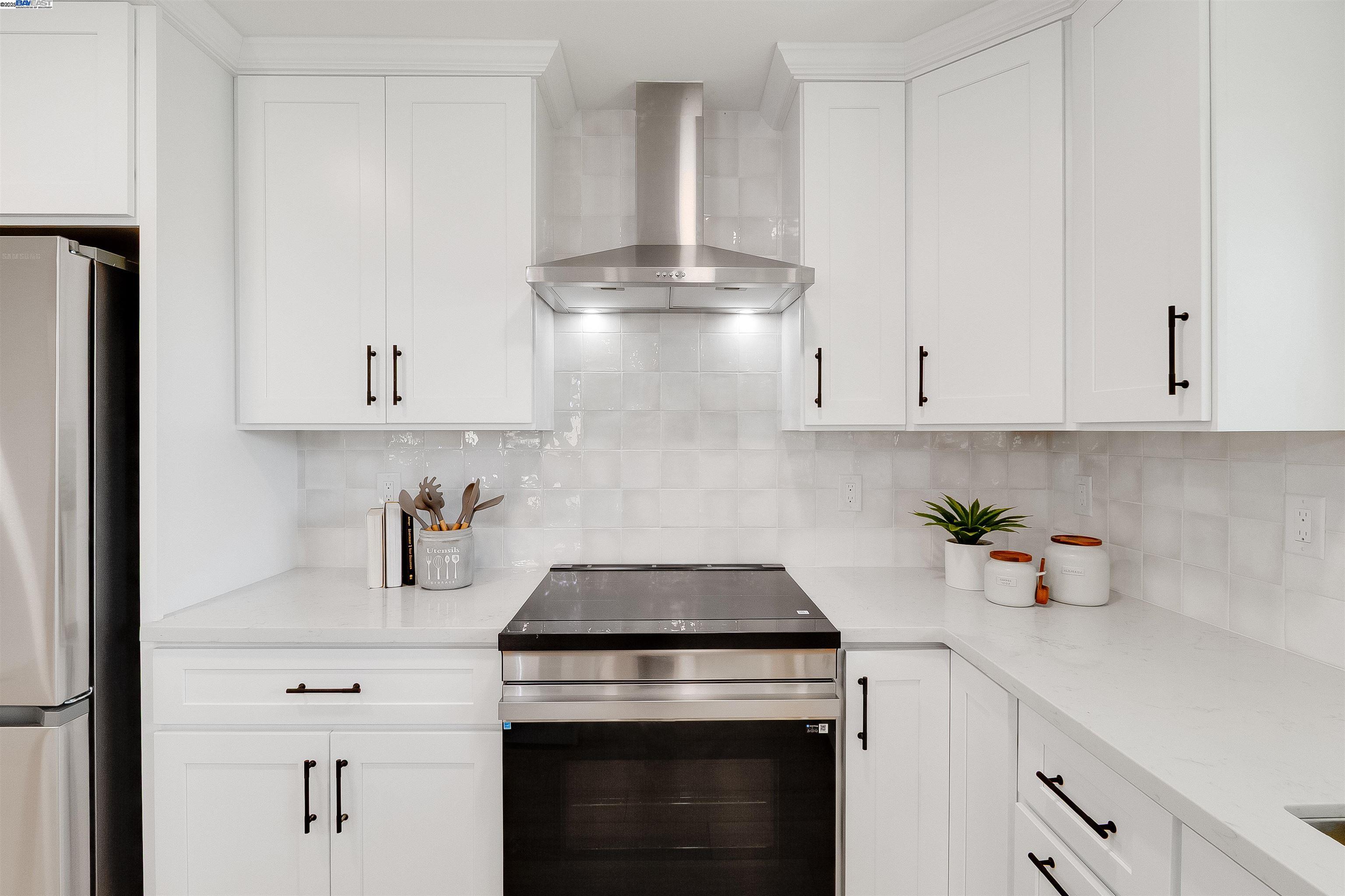 736 Adams Avenue Livermore, CA 94550 - Photo 21 of 52 a kitchen with white cabinets and white appliances