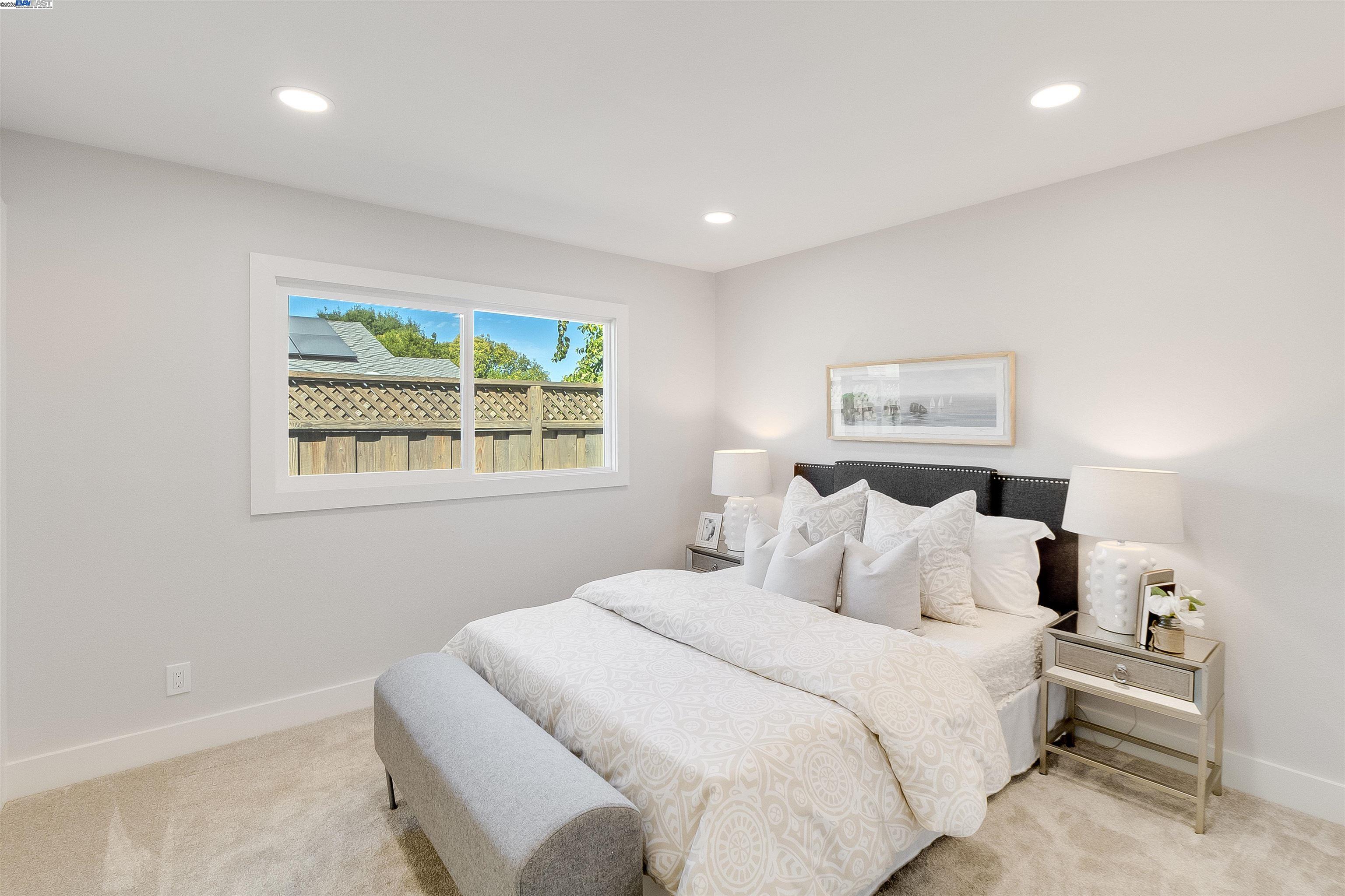 736 Adams Avenue Livermore, CA 94550 - Photo 32 of 52 a bedroom with a bed and a painting on the wall