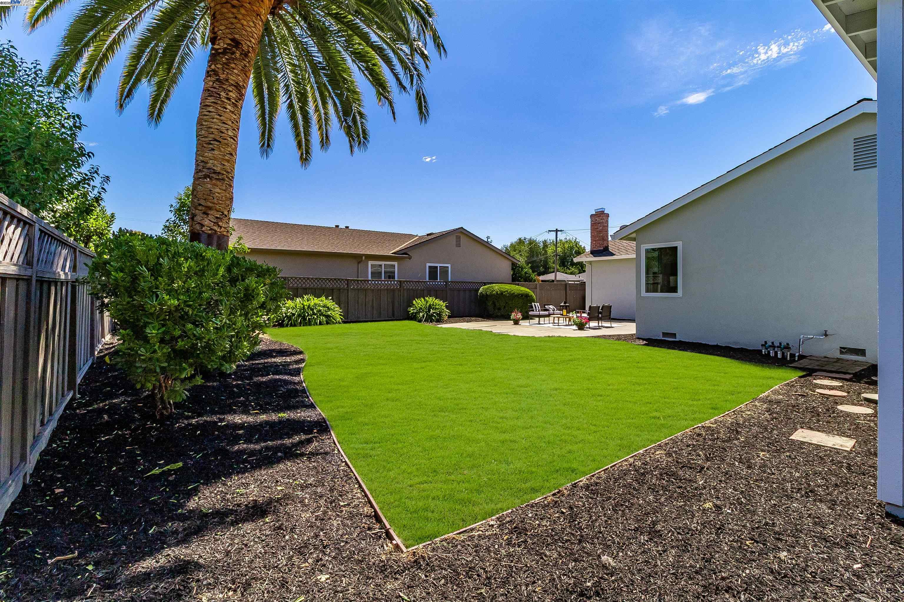 736 Adams Avenue Livermore, CA 94550 - Photo 47 of 52 a view of a backyard with potted plants